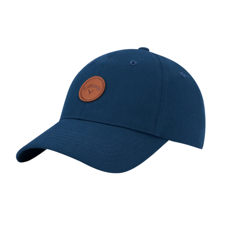 Blue baseball cap with a brown leather patch on a white background