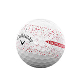 Callaway golf ball with red speckles on a white background