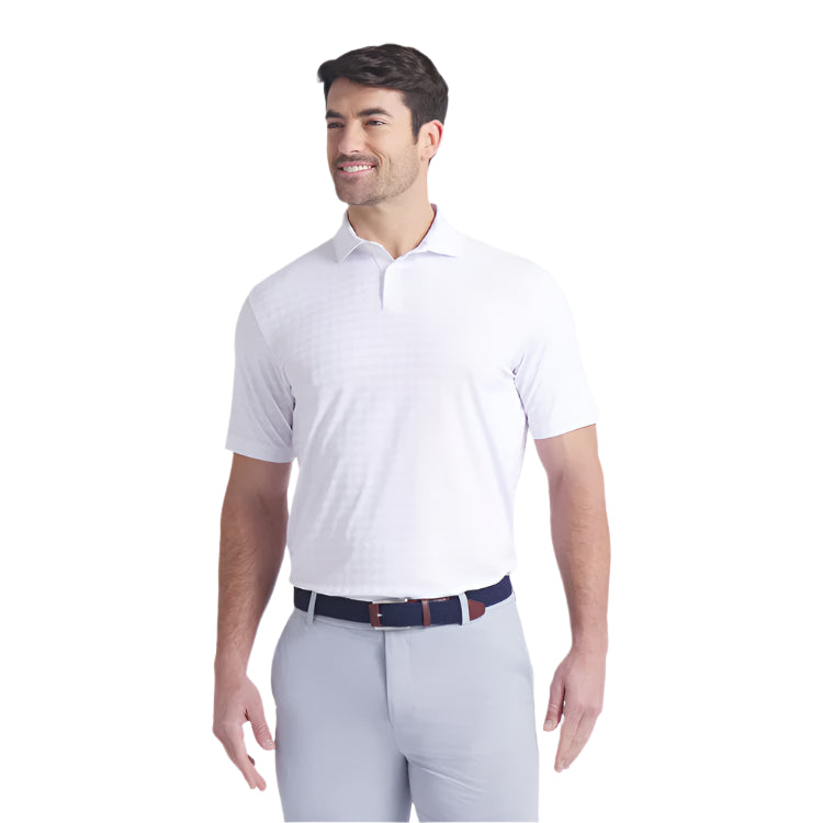 Man wearing a white polo shirt and light gray pants on a white background