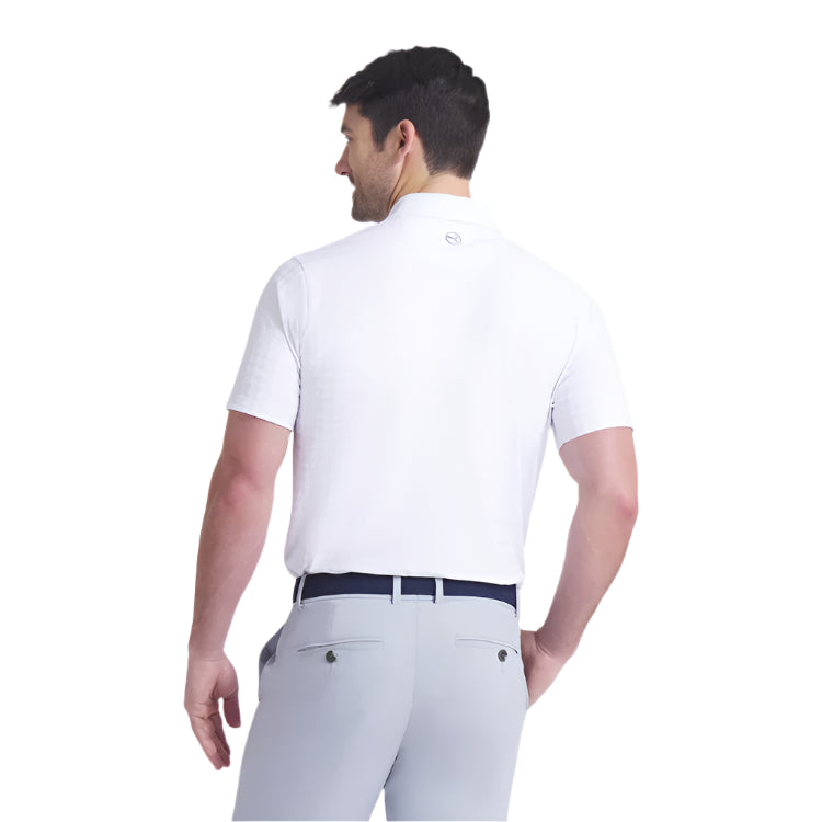 Man wearing a white polo shirt and gray pants on a white background