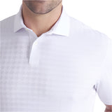 Close-up of a white patterned polo shirt on a plain background