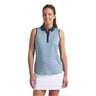 Woman wearing a sleeveless patterned top and white skirt on a light gray background