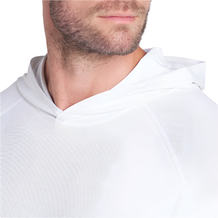 Close-up of a person wearing a white hoodie with a neutral background