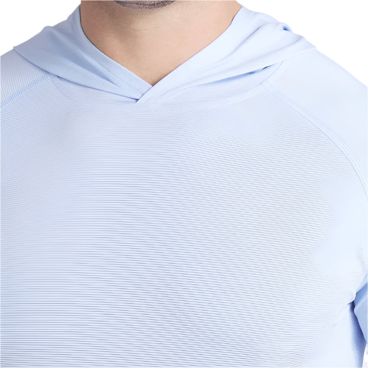 Light blue hoodie worn by a person on a white background