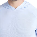 Light blue hoodie worn by a person on a white background